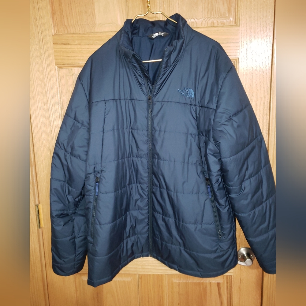 The North Face Men's Jacket Color is Dark Blue.
